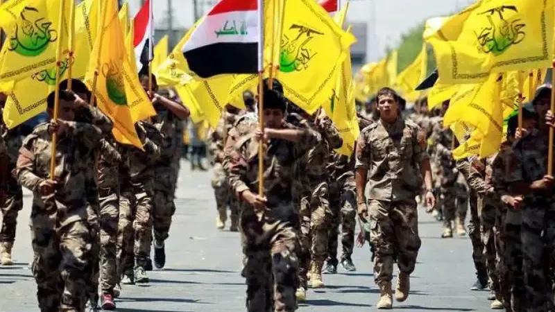 Iraqi Shiite Muslims from the Popular Mobilization Units (Hashd al-Shaabi) march during a parade marking the annual Quds Day, or Jerusalem Day, in Baghdad, Iraq, June 23, 2017.