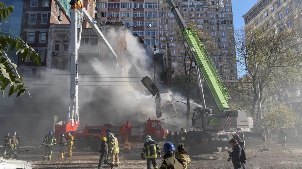 Rescue workers in Kyiv arrive after an Iranian drone hits a building. October 17, 2022