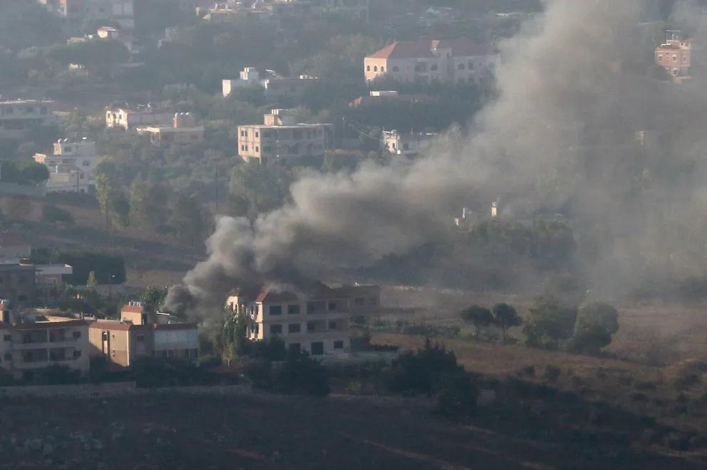 Smoke rises from the southern Lebanese town of Khiam, amid ongoing cross-border hostilities between Hezbollah and Israeli forces, as pictured from Marjayoun, near the border with Israel, August 25, 2024. 