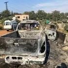 Media personnel stand near a damaged vehicle in the aftermath of what Syrian state media reported was an Israeli strike in Hama, Syria September 9, 2024. 